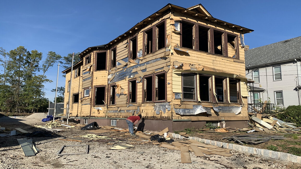 Foreclosure property before sale in Elizabeth NJ with visible exterior distress and poor condition