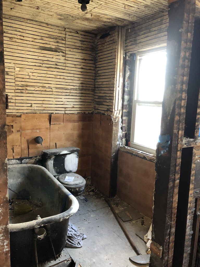 Fire-damaged bathroom at 850 Gibbons Ct in Elizabeth NJ before renovation