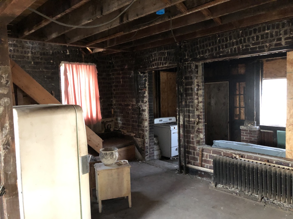 Fire-damaged living room at 850 Gibbons Ct in Elizabeth NJ before renovation